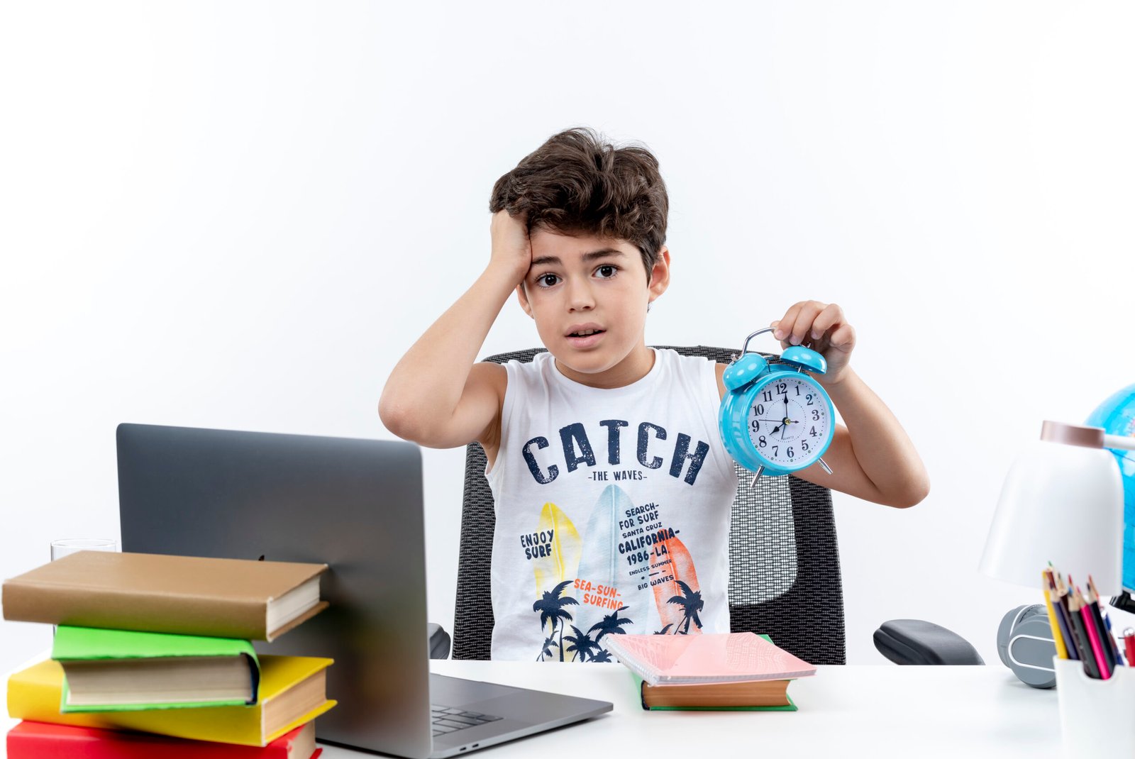 concerned-little-schoolboy-sitting-desk-with-school-tools-holding-alarm-clock-grabbed-head-isolated-white-background.jpg